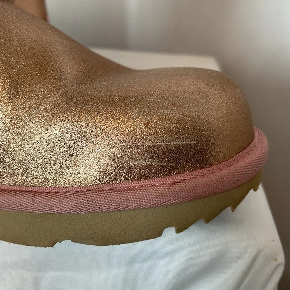 UGG boots size 6 metallic rose gold trimmed in pink with tan soles